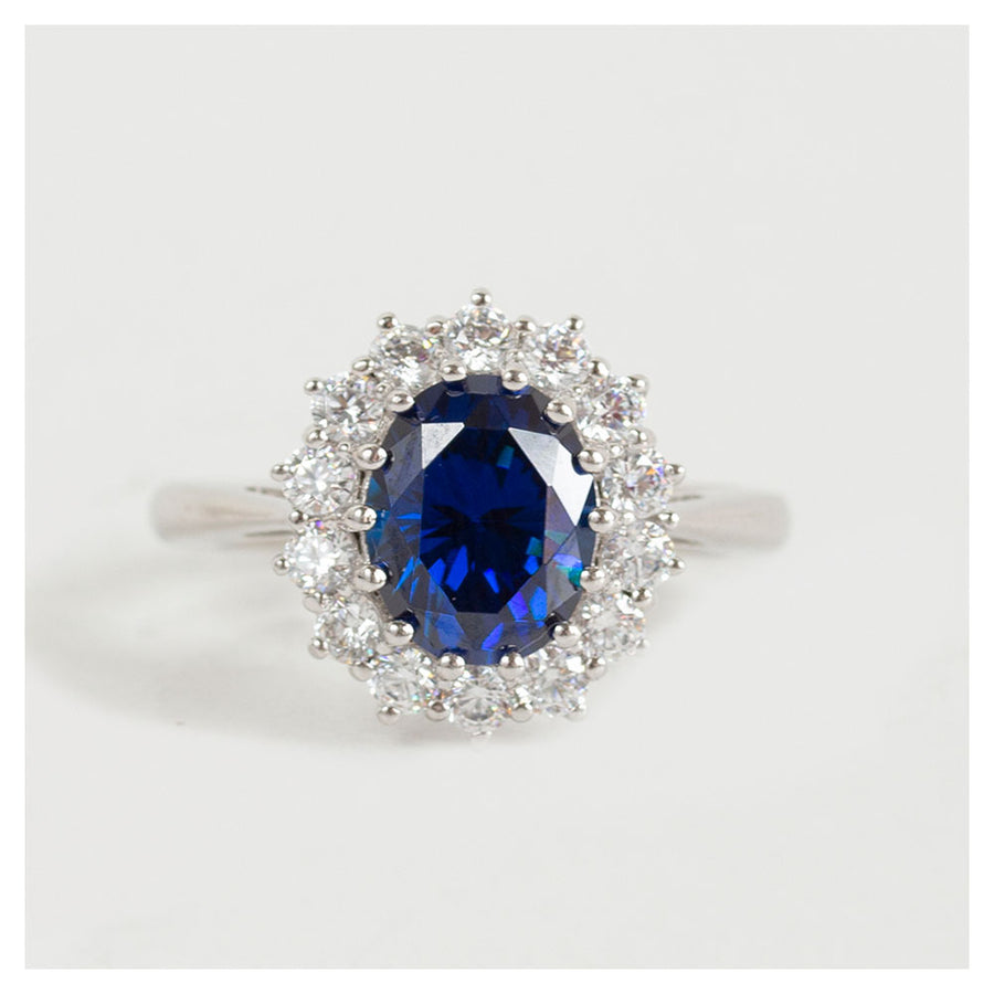Vintage zilveren ring met blauwe saffier en zirkonia steentjes